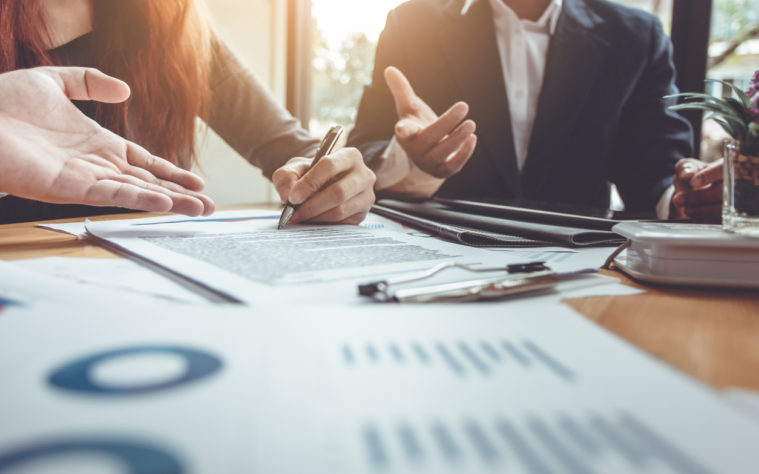 Business Signing a Contract Buy - sell house.