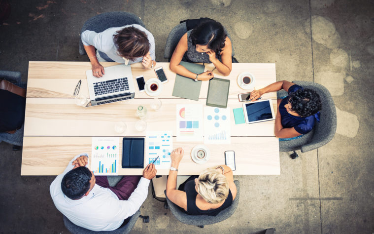 Group of financial professionals analyzing markets